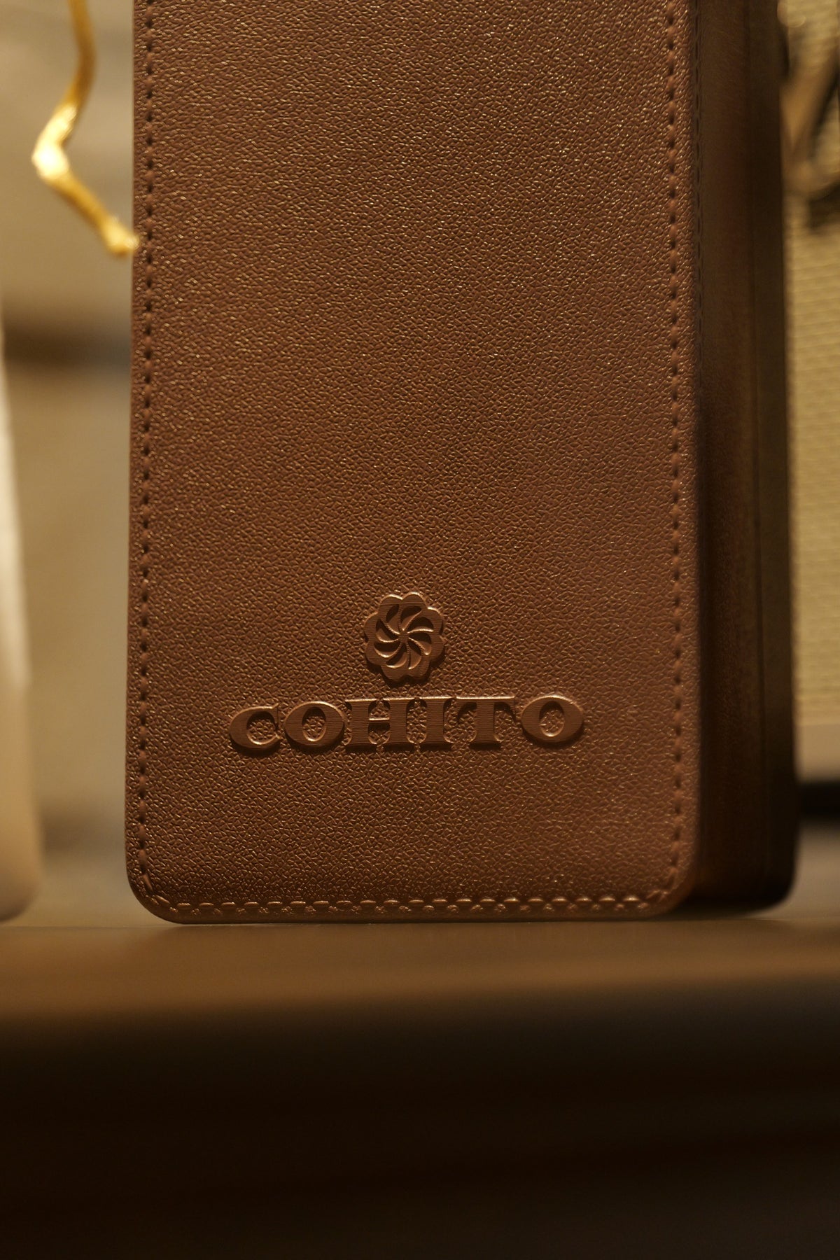 Embossed Cohito logo on the brown EVA bottle holder